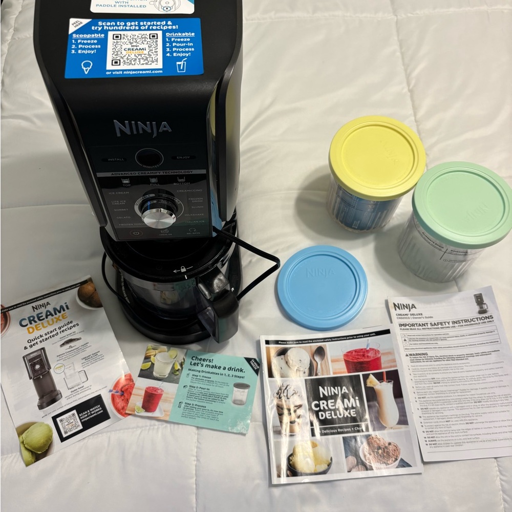 Ninja Creami Deluxe Ice Cream Maker in Black with Yellow, Mint, and Blue Lids